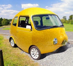 Lemon car parked on the side of the road